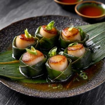 夏季美味佳肴：蒜香爆炒金針菇花甲螺